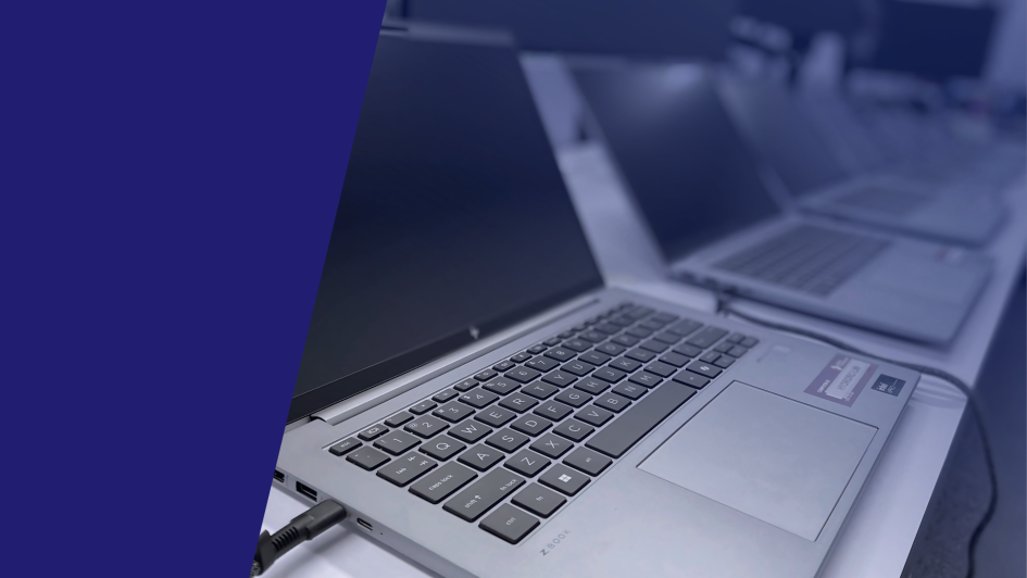 Replace, Repair or Risk It? The left side features bold white text on a dark blue background with the Bigfish Technology logo, while the right side shows a row of laptop computers, suggesting the importance of managing device health and replacement cycles in a business setting.
